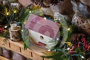 Mantel decorated for Christmas with lights photo