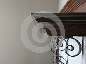 Mantel over a painted brick fireplace in an old home