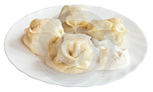 Manti dumpling on white plate isolated