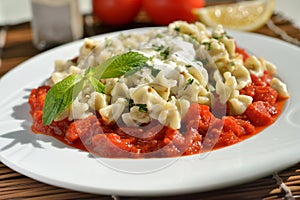 Mantu with tomato and yogurt