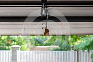 Manual cable operated garage shutter door opener inside to out view point