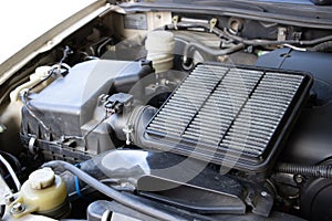 Manual car air filter replacement to maintain engine performance.Air filter is clogged. Causing incomplete combustion in the
