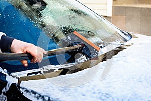 Manual car wash with high pressure washing outside.