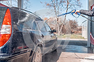 Manual car wash by spraying treated water under high pressure
