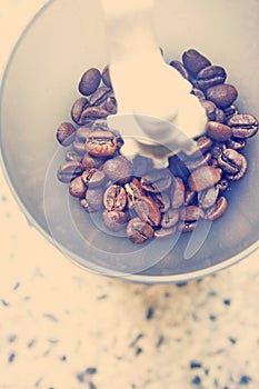 Manual coffee grinder with coffee beans