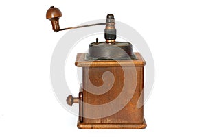 Manual coffee grinder on a white background. Antiquary