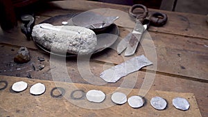 Manual coinage. coinage in the anvil. Work place. Ancient Russia art.