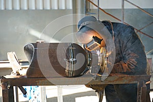 Manual electric arc welding of the junction Du 100 and flange photo