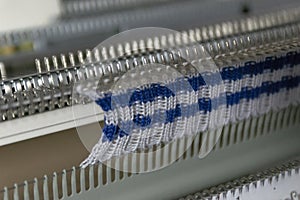 Manual knitting machine. A knitting machine is a device used to create knitted fabrics