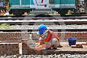 manual laborer working masonry brick installing hand work