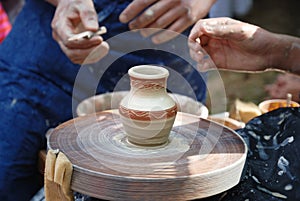 Manual making of an earthenware pot