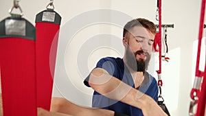 Manual, physio, kinesio therapy techniques performed by a male physiotherapist.