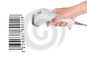 The manual scanner of bar code in a female hand