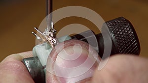 Manual setting of the precious stones in jewelry