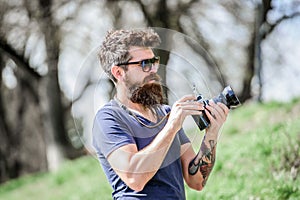 Manual settings. Photographer hold vintage camera. Modern blogger. Photographer with beard and mustache. Man shooting