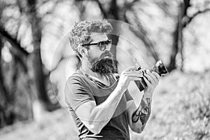 Manual settings. Photographer hold vintage camera. Modern blogger. Photographer with beard and mustache. Man shooting