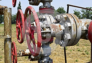 Manual shut-off valve on oil well. Oil well wellhead equipment.