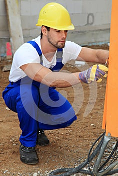 Manual worker checking power supply