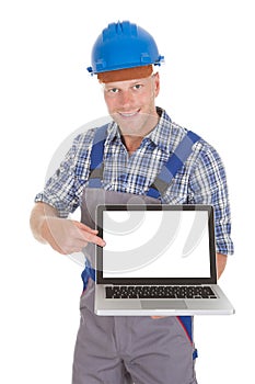 Manual Worker Displaying Laptop