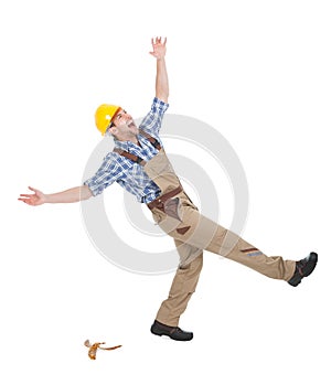 Manual worker falling over white background