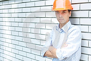 Manual worker standing near a wall