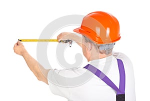 Manual worker with tape measure