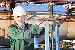 Manual worker turning big valve