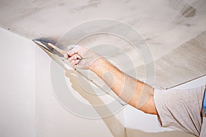 Manual worker with wall plastering tools