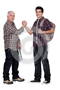 Manual worker welcoming intern