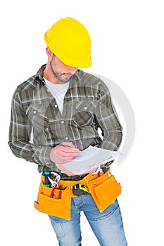 Manual worker writing on clipboard