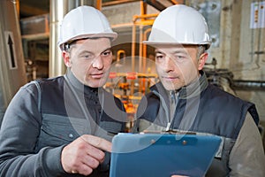 manual workers working with clipboard