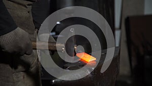 Manually Forging Molten Metal on the Anvil