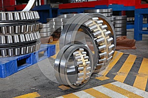 Manufacture of bearings in the factory.The chrome surface of products. Industrial theme. Production of bearings