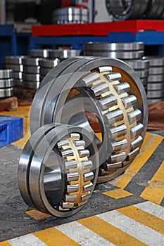 Manufacture of bearings in the factory.The chrome surface of products. Industrial theme. Production of bearings