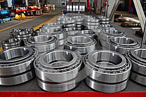 Manufacture of bearings in the factory.The chrome surface of products. Industrial theme. Production of bearings