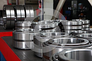 Manufacture of bearings in the factory.The chrome surface of products. Industrial theme. Production of bearings