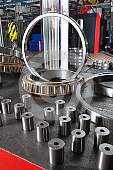 Manufacture of bearings in the factory.The chrome surface of products. Industrial theme. Production of bearings