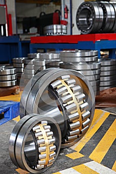 Manufacture of bearings in the factory.The chrome surface of products. Industrial theme. Production of bearings