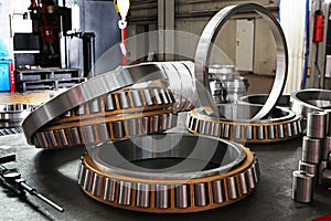 Manufacture of bearings in the factory.The chrome surface of products. Industrial theme. Production of bearings