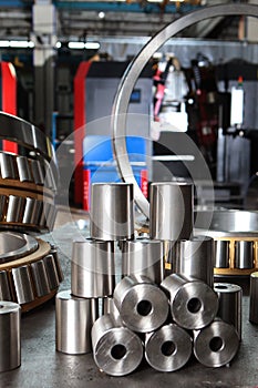 Manufacture of bearings in the factory.The chrome surface of products. Industrial theme. Production of bearings