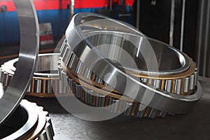 Manufacture of bearings in the factory.The chrome surface of products. Industrial theme. Production of bearings