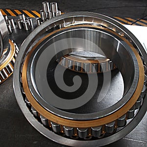 Manufacture of bearings in the factory.The chrome surface of products. Industrial theme. Production of bearings