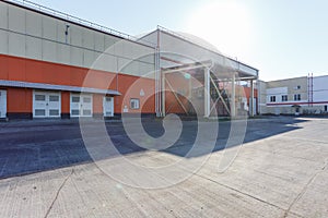 Manufacture building of modern waste recycling processing plant in orange style. Separate garbage collection. Recycling and