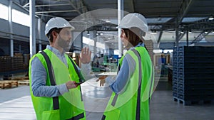 Manufacture employees with tablet checking shipment factory distribution talking