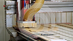 Manufacture of furniture, facades of MDF and wood. special machine cuts facades from MDF board. mdf details. furniture