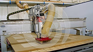 Manufacture of furniture, facades of MDF and wood. special machine cuts facades from MDF board. mdf details. furniture