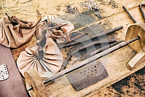 Manufacture of medieval armor and chain mail to protect soldiers in battle. Reconstruction of the events of the Middle Ages in