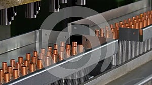 Manufacture of metal copper pipes on industrial CNC machine.
