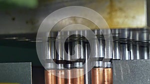 Manufacture of metal copper pipes on industrial CNC machine.