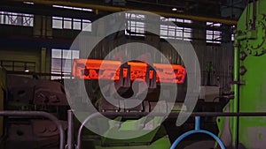 Manufacture of rails for trains and freight wagon, boxcars. Rail manufacturing plant. Stack of steel round bar - iron